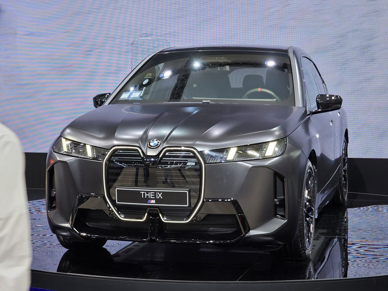 Illuminated double kidney grille with sleek modern LED headlights.
