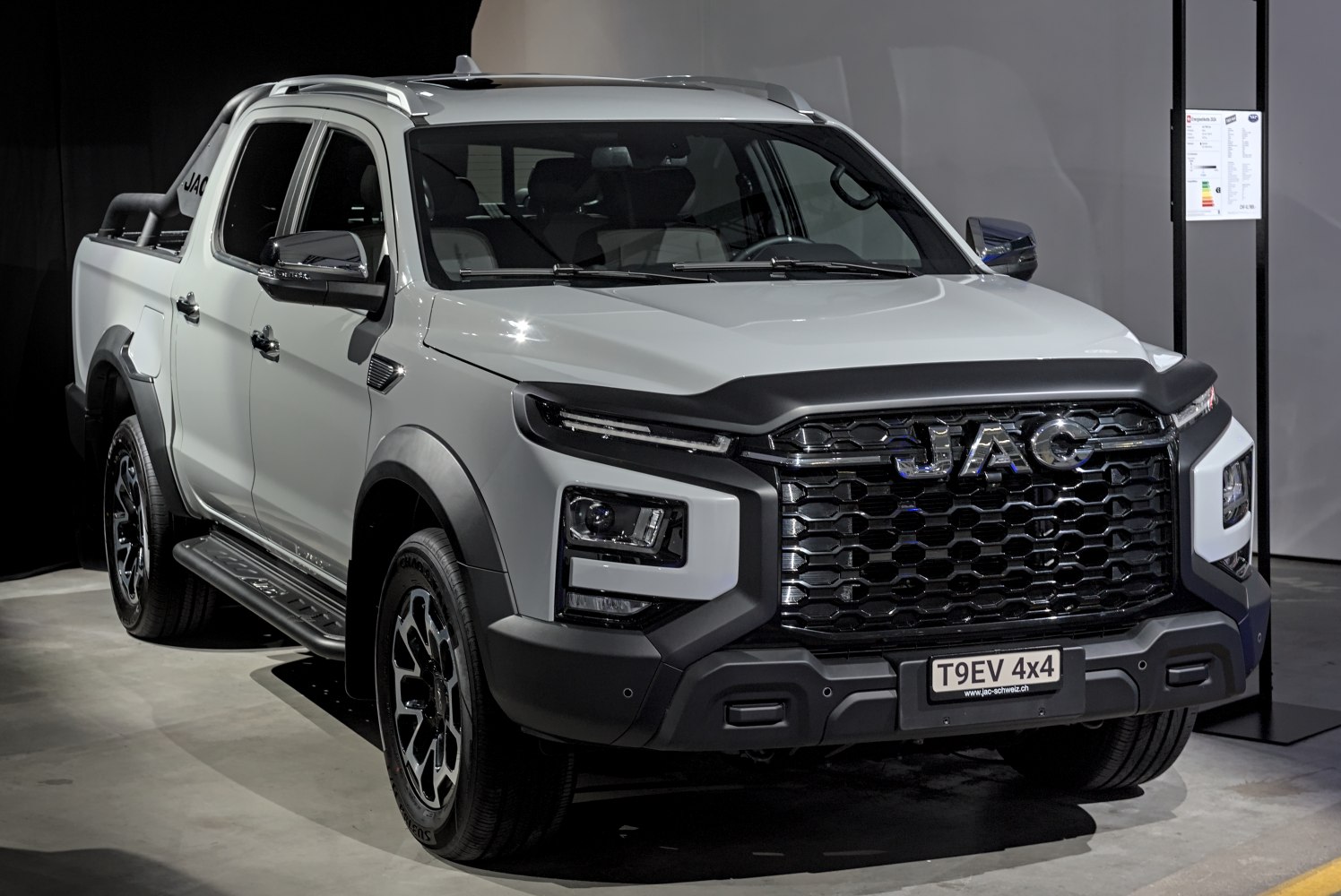 Modern double cab pickup with bold front grille and LED headlights