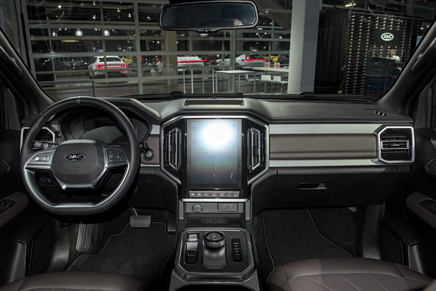 Modern dashboard with large touchscreen and multifunction steering wheel