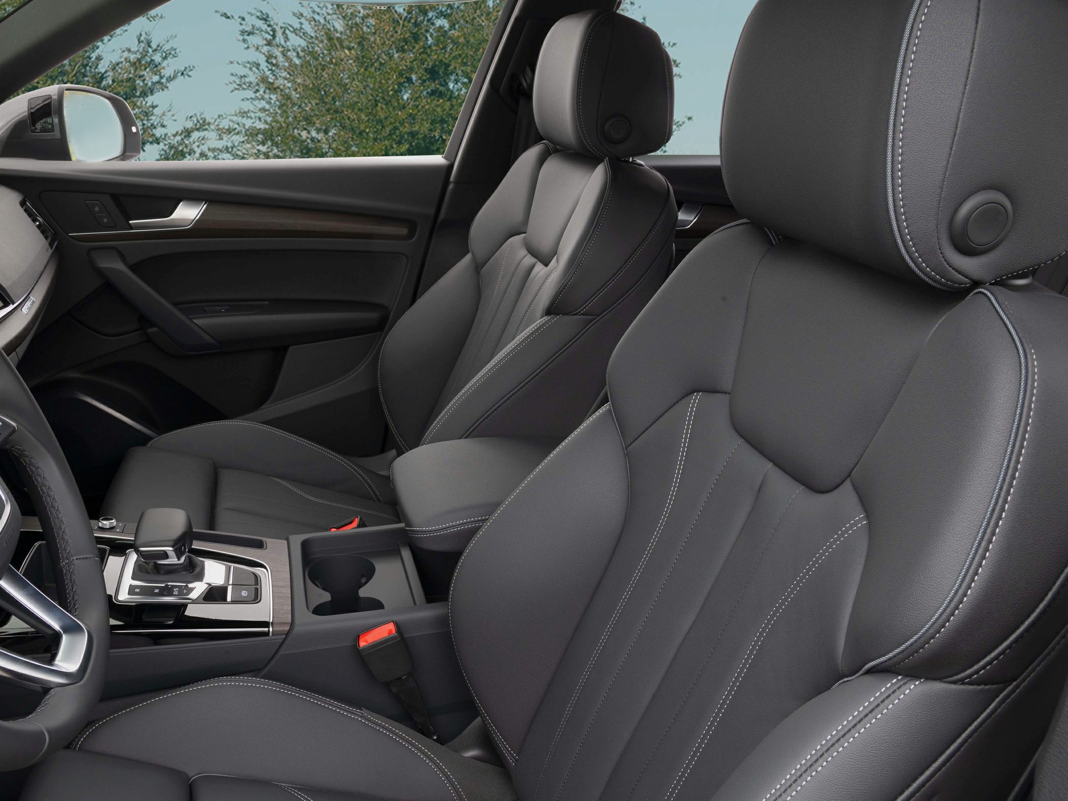 Leather seats with contrast stitching and center console with gear selector.