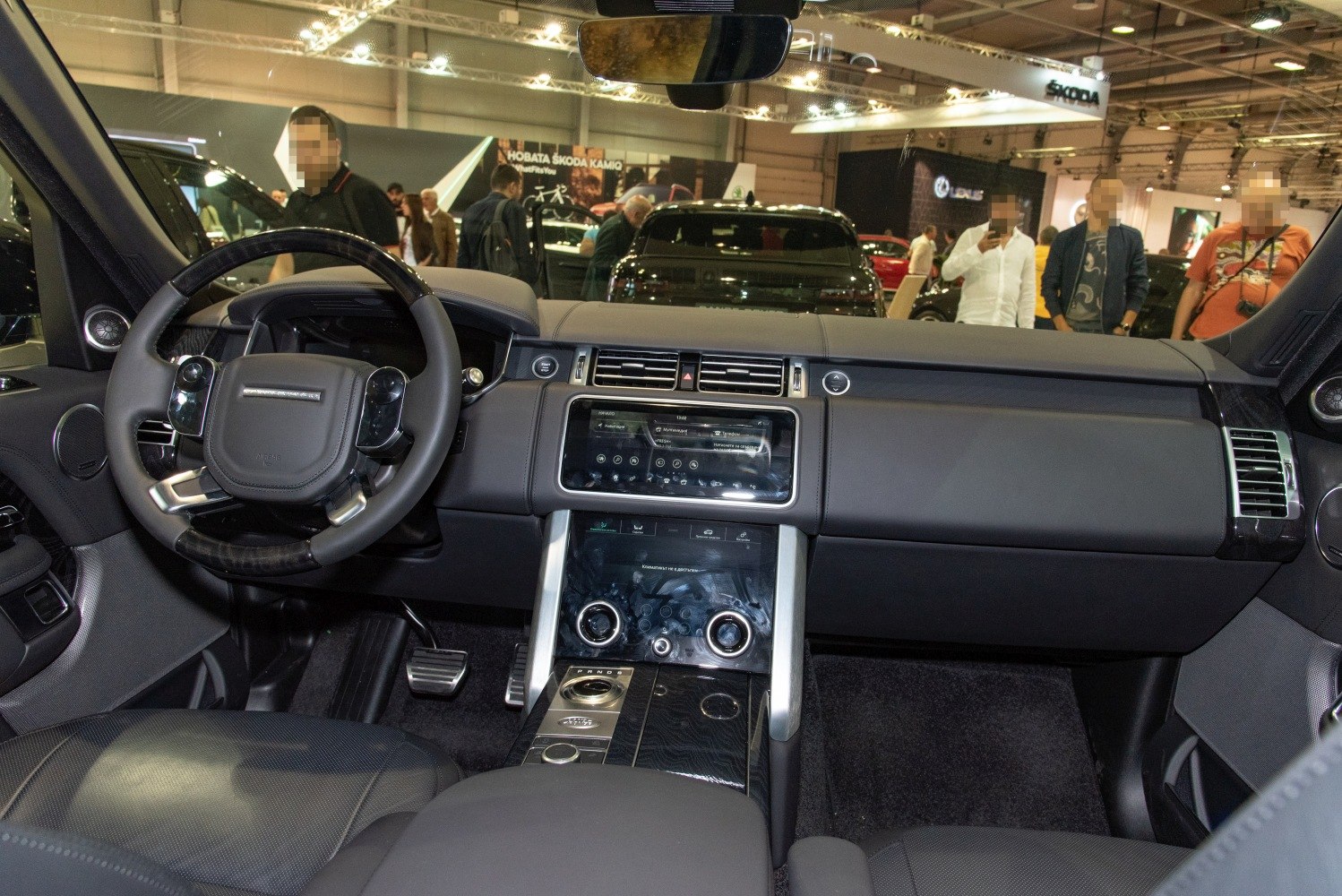 Luxury SUV interior with digital dashboard and dual touchscreen console