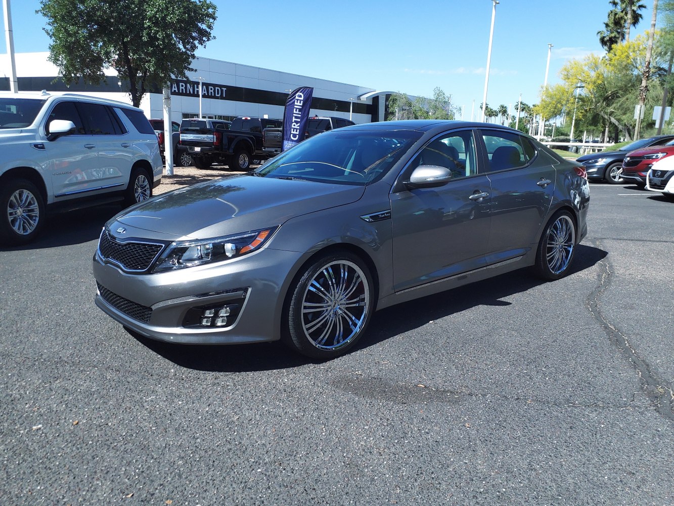 Sleek silver sedan with modern headlights and distinctive alloy wheels.