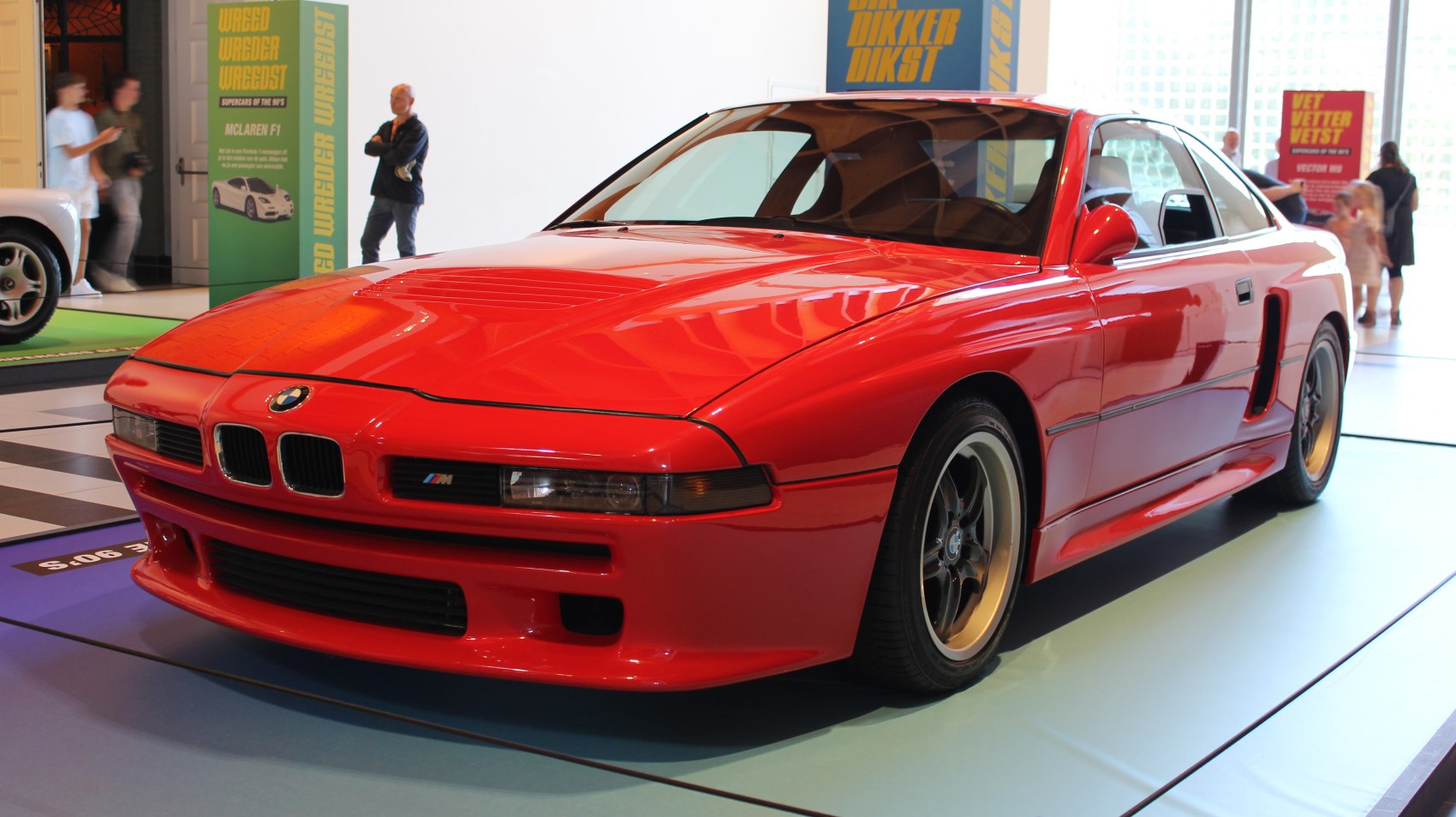 Red sports coupe with aerodynamic design and kidney grille