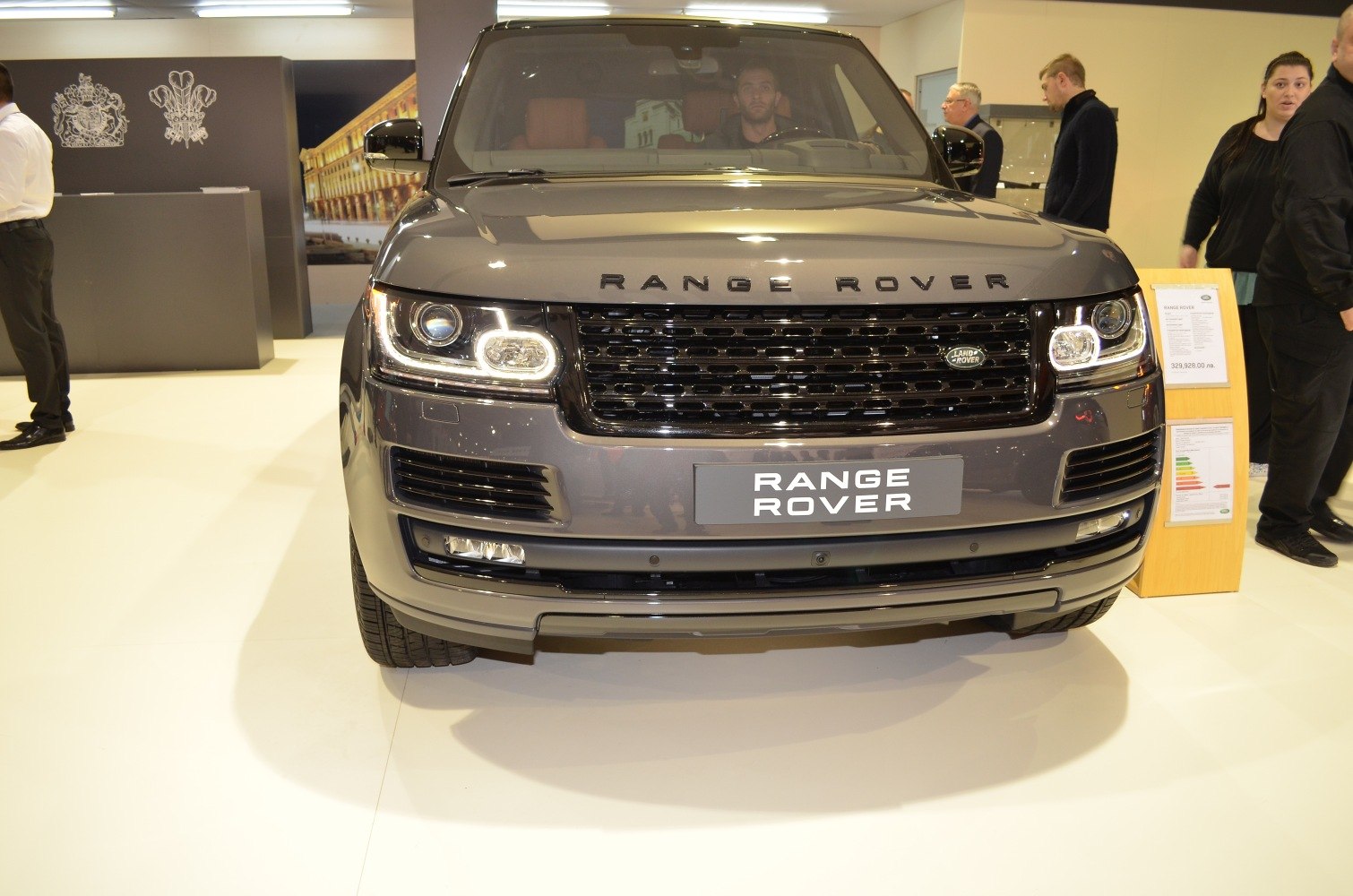 Front view with distinctive LED headlights and bold grille
