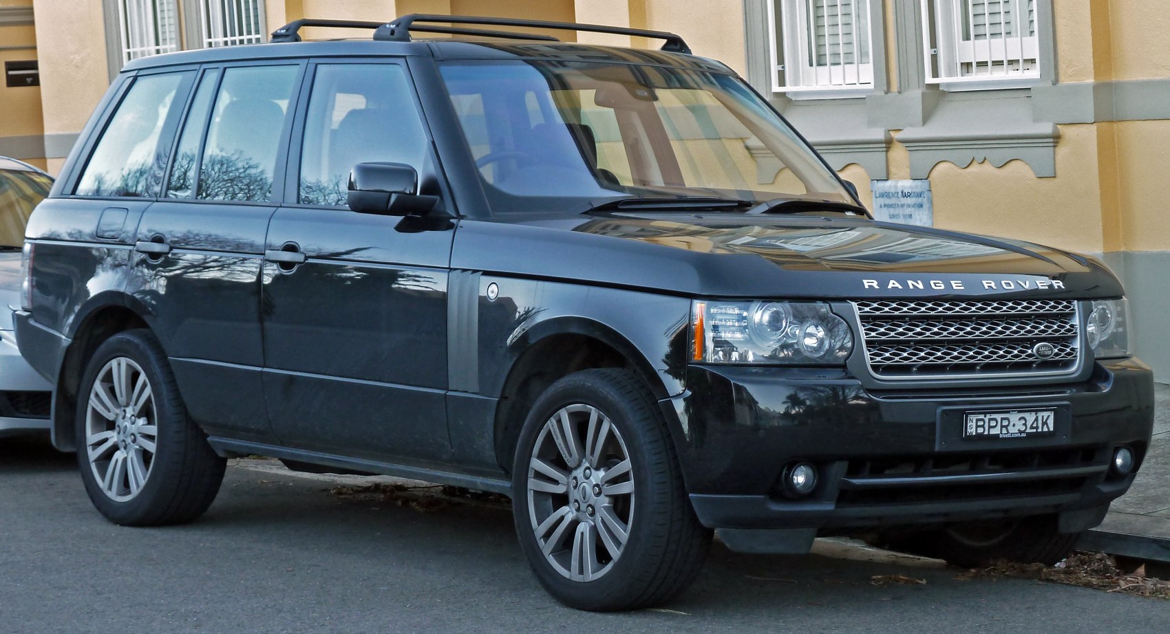 Black SUV front three-quarter view with grille and headlights