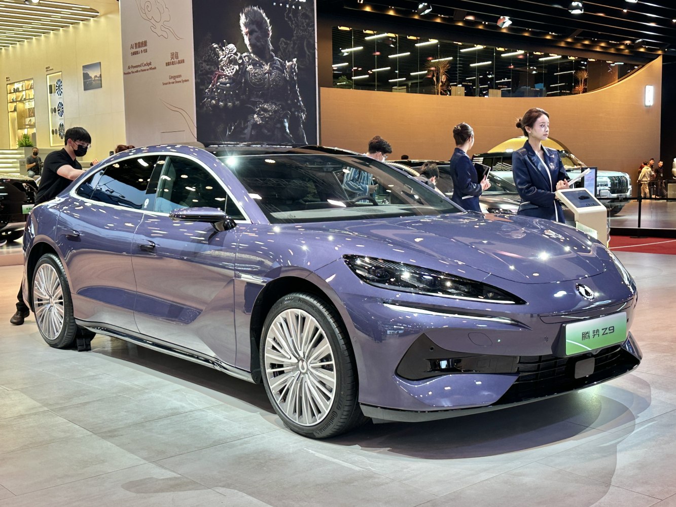 Sleek front-side profile of a modern electric sedan with aerodynamic body and sharp LED headlights.