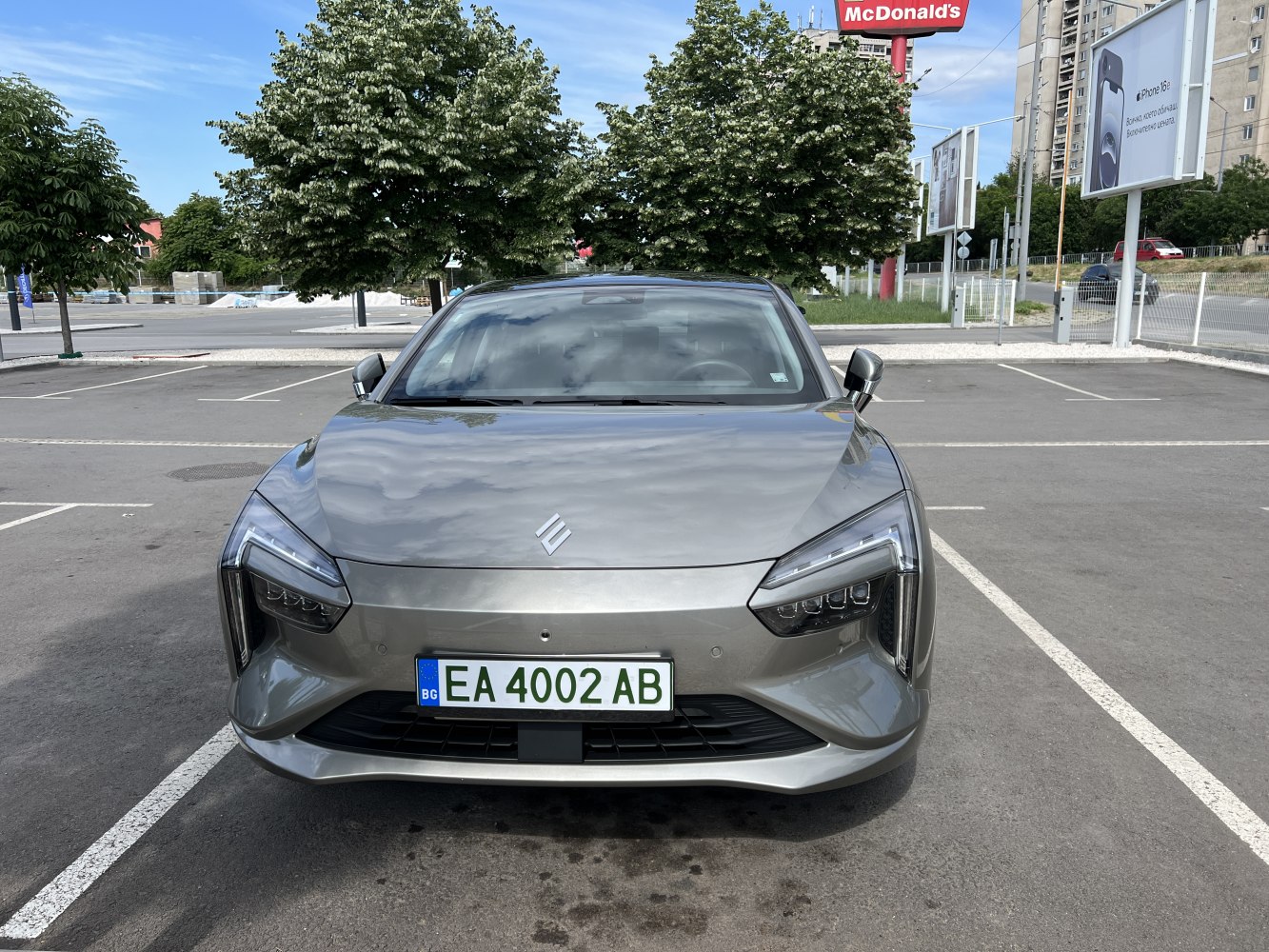 Modern angular headlights and aerodynamic smooth hood in front view