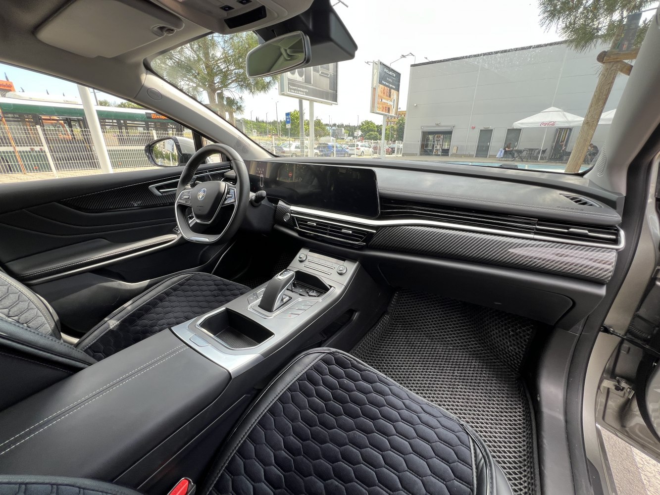 Digital dashboard and ergonomic center console with modern steering wheel