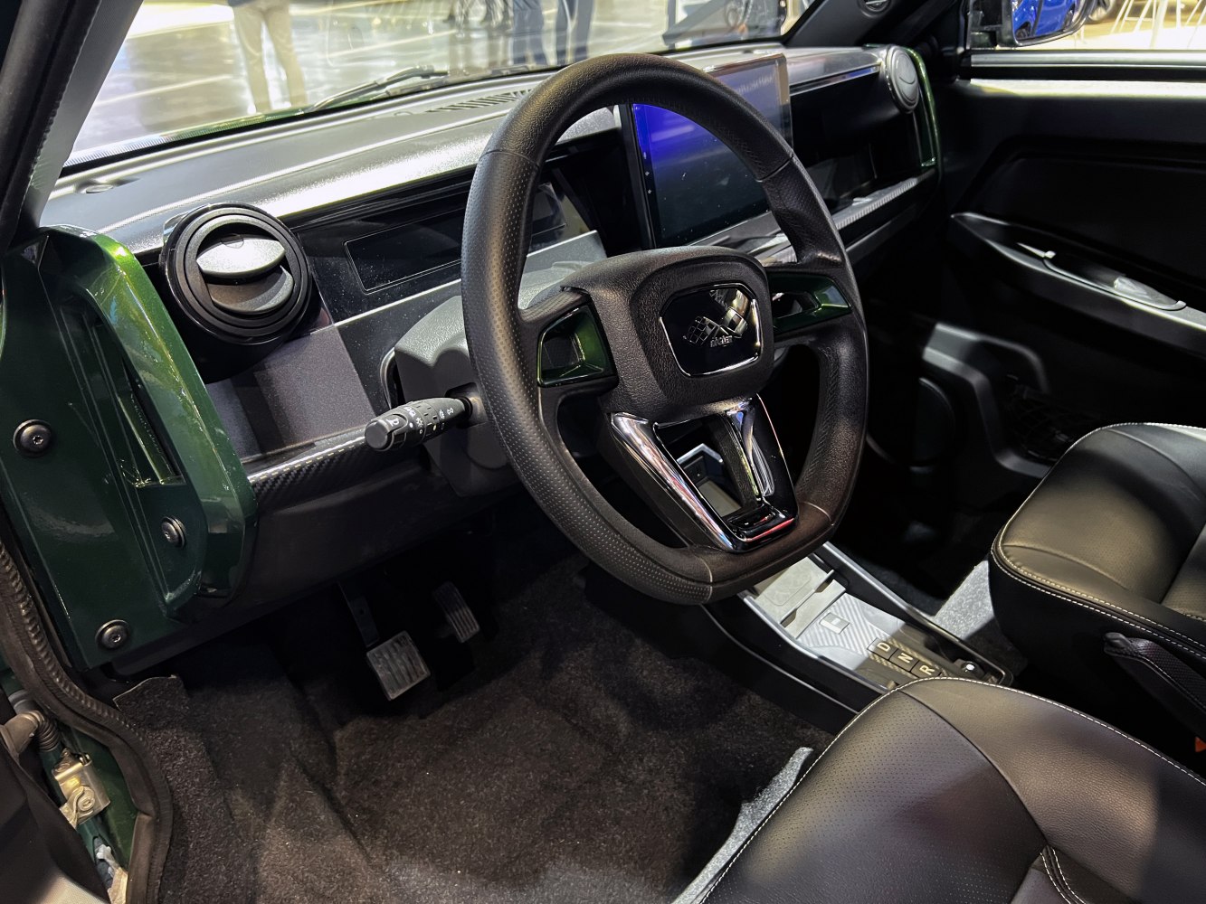 modern steering wheel and digital dashboard in car interior