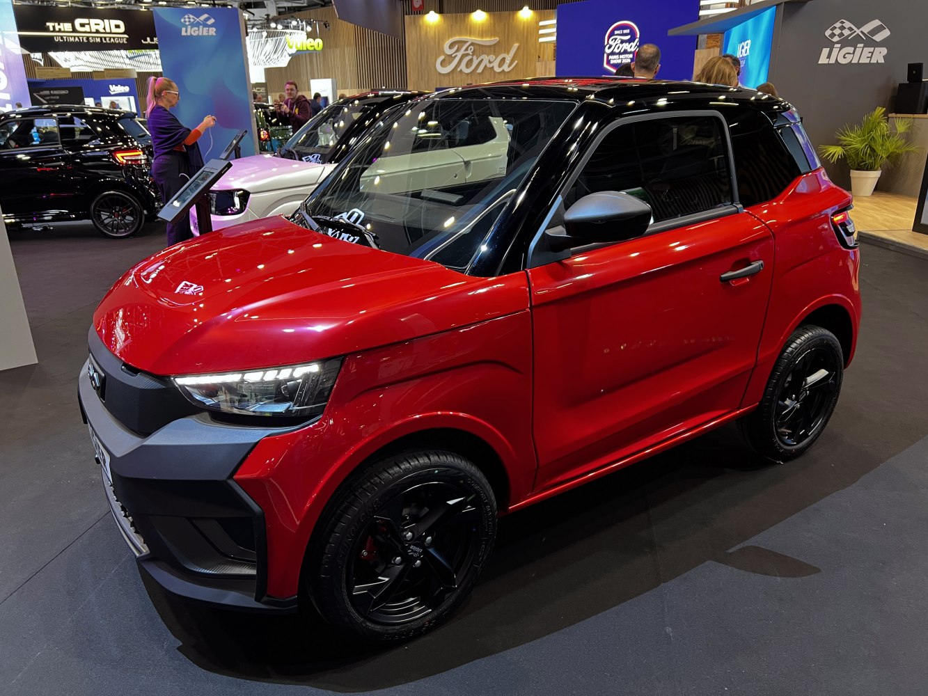 Red compact SUV with black roof and black alloy wheels
