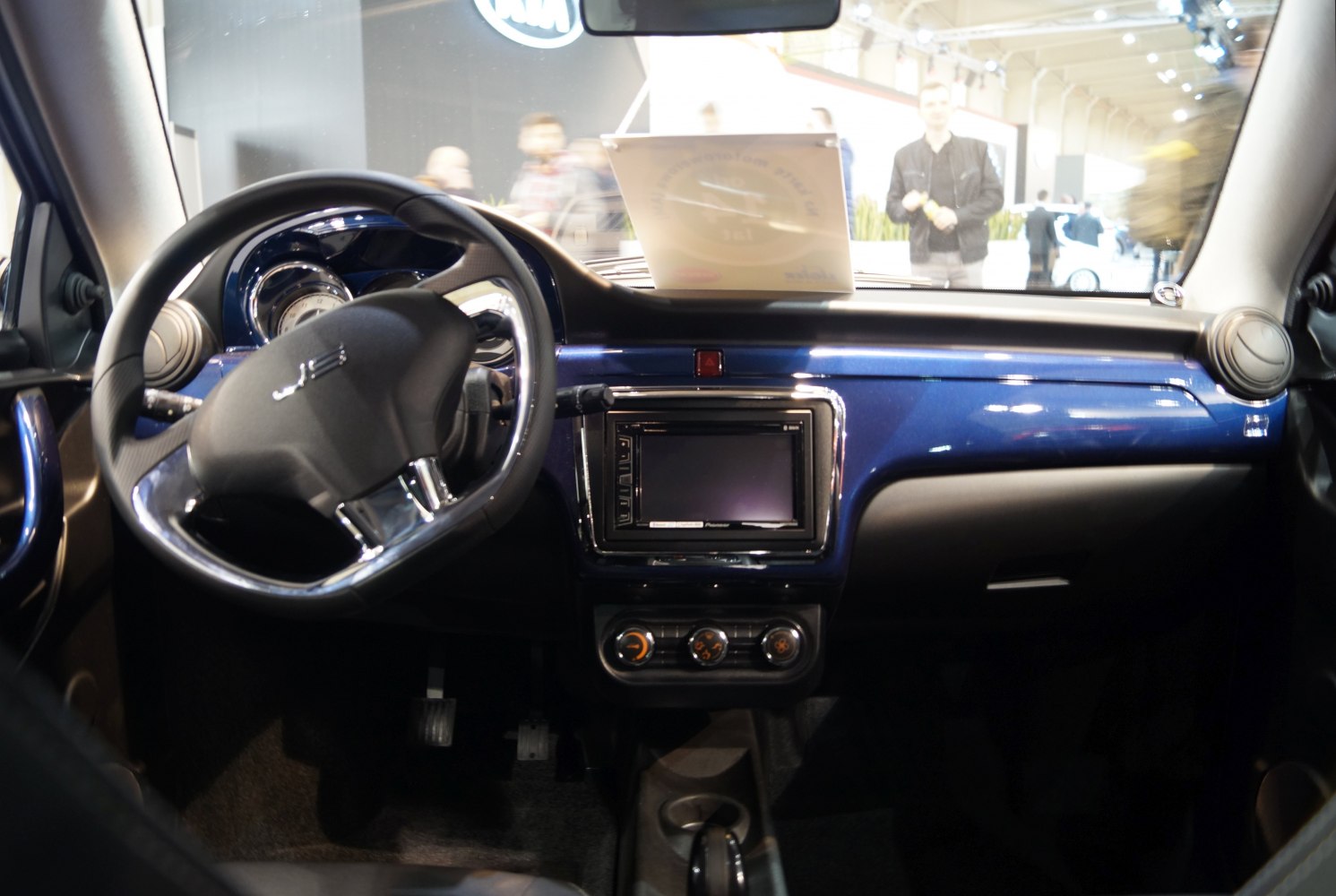 Interior dashboard and steering wheel with central touchscreen