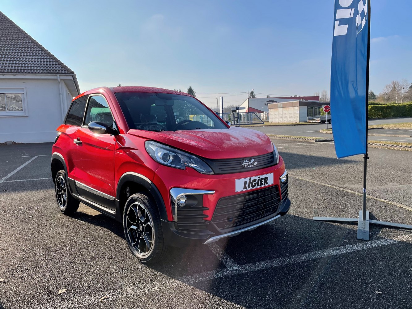 Compact red SUV with modern headlights and sporty alloy wheels