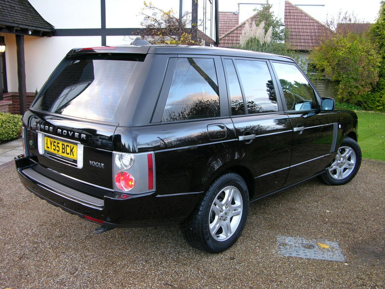 Rear side view with distinctive tail lights and alloy wheels