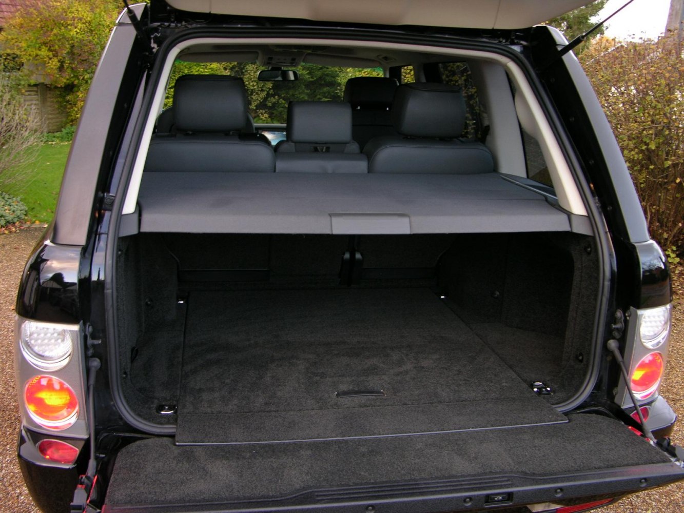 Spacious SUV cargo area with rear seats and cargo cover