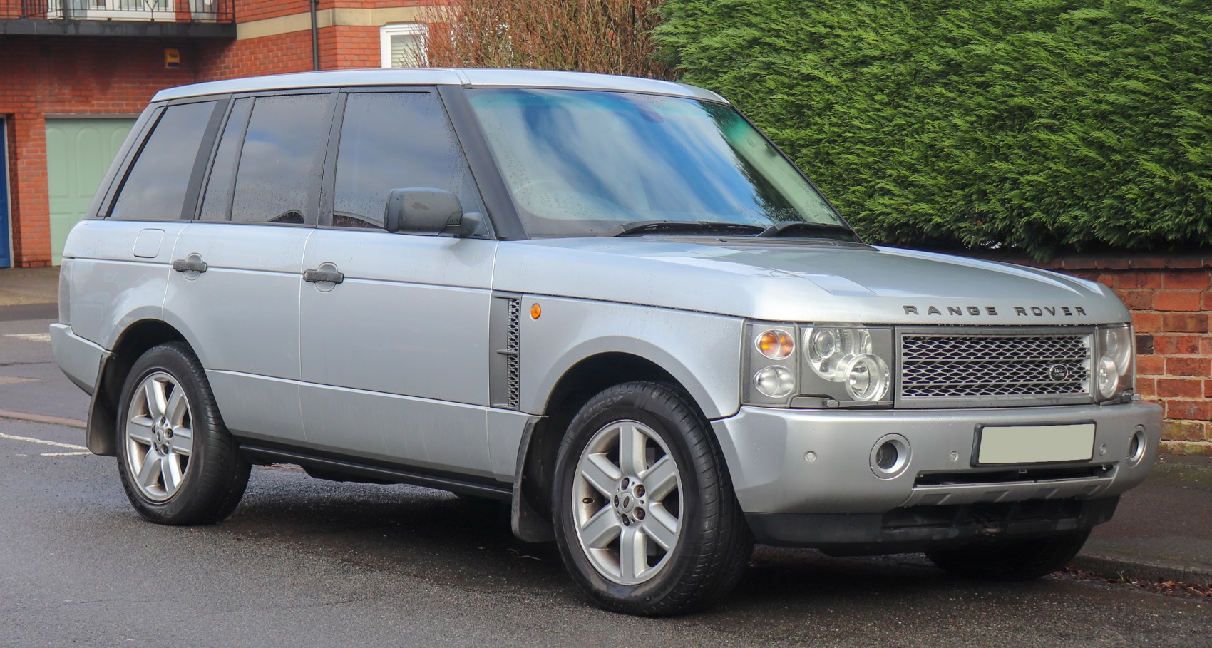 Silver SUV with front grille and dual headlights