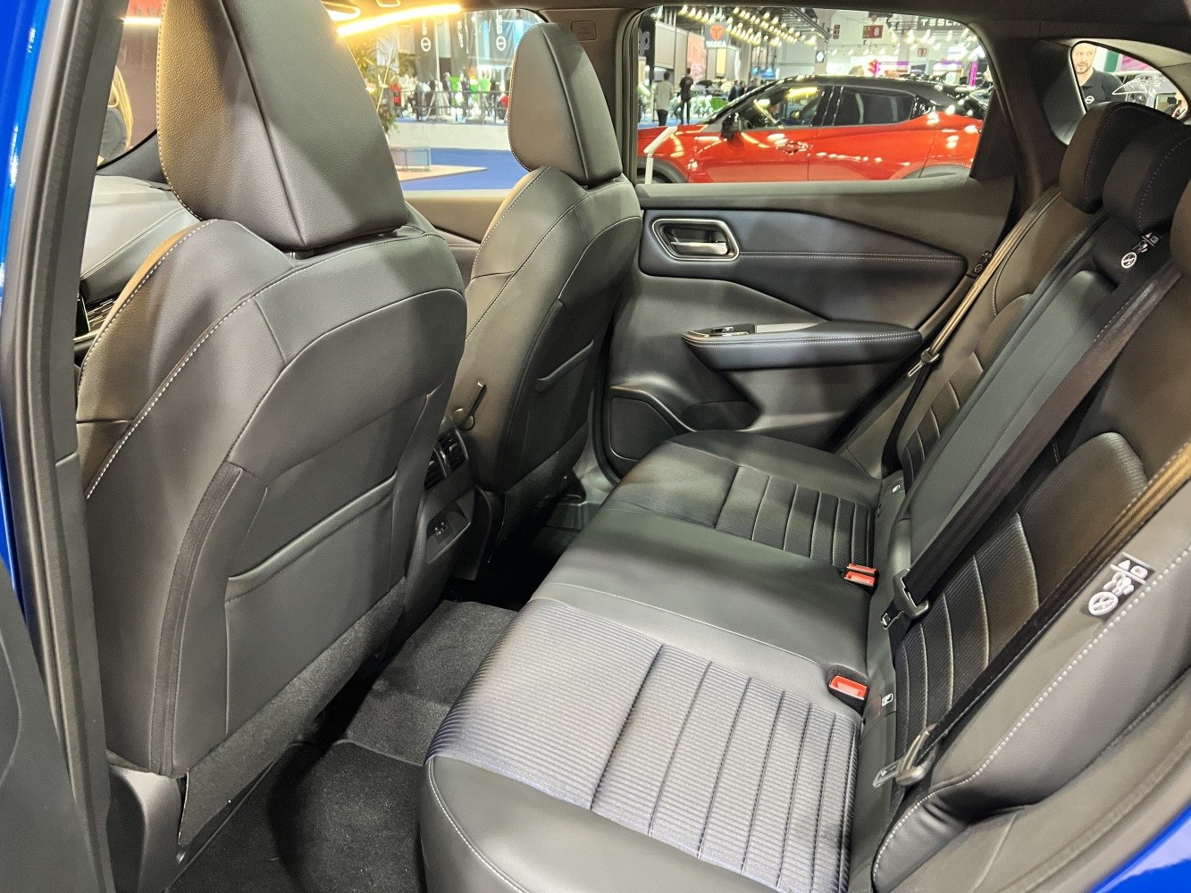 Rear seating with leather and fabric upholstery, spacious passenger cabin