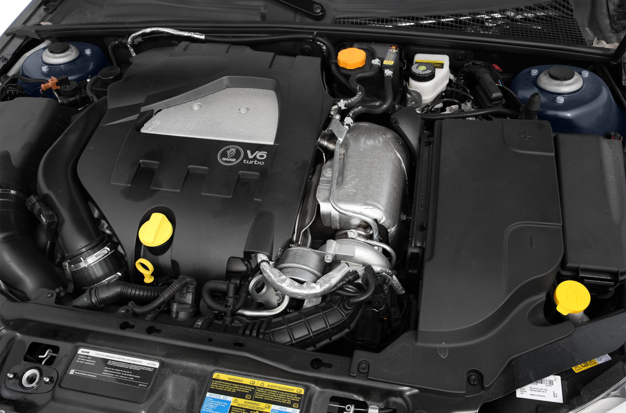V6 turbo engine bay with visible turbocharger and fluid reservoirs