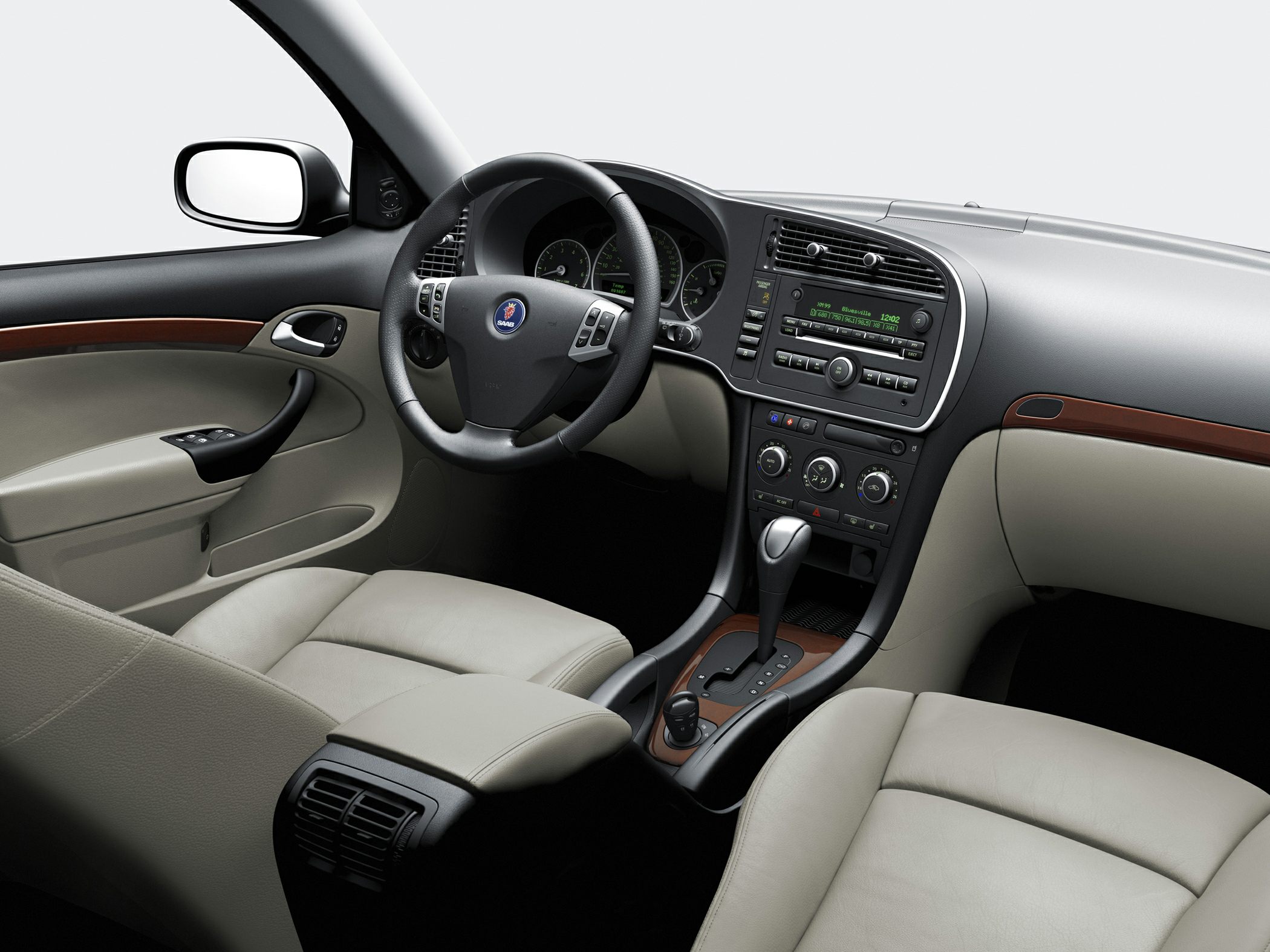 Leather steering wheel and central dashboard with controls.