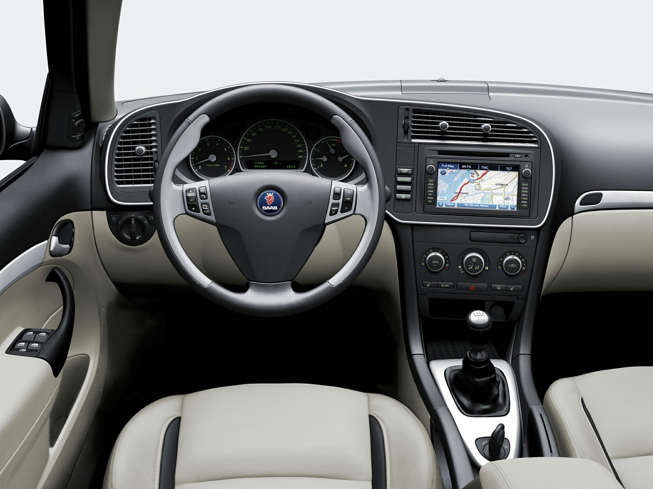 Navigation display and manual gear shift in beige interior
