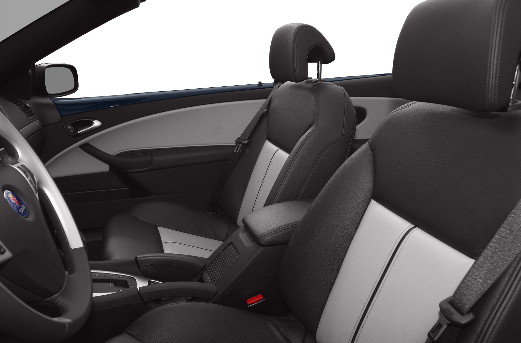 Leather seats with black and gray upholstery next to center console and seatbelt