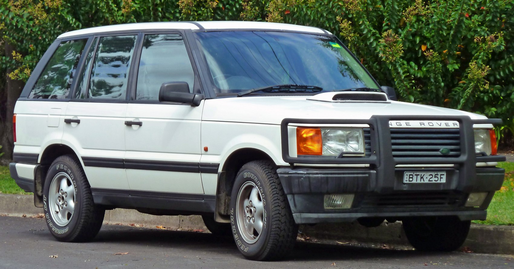 SUV front with bull bar and hood scoop