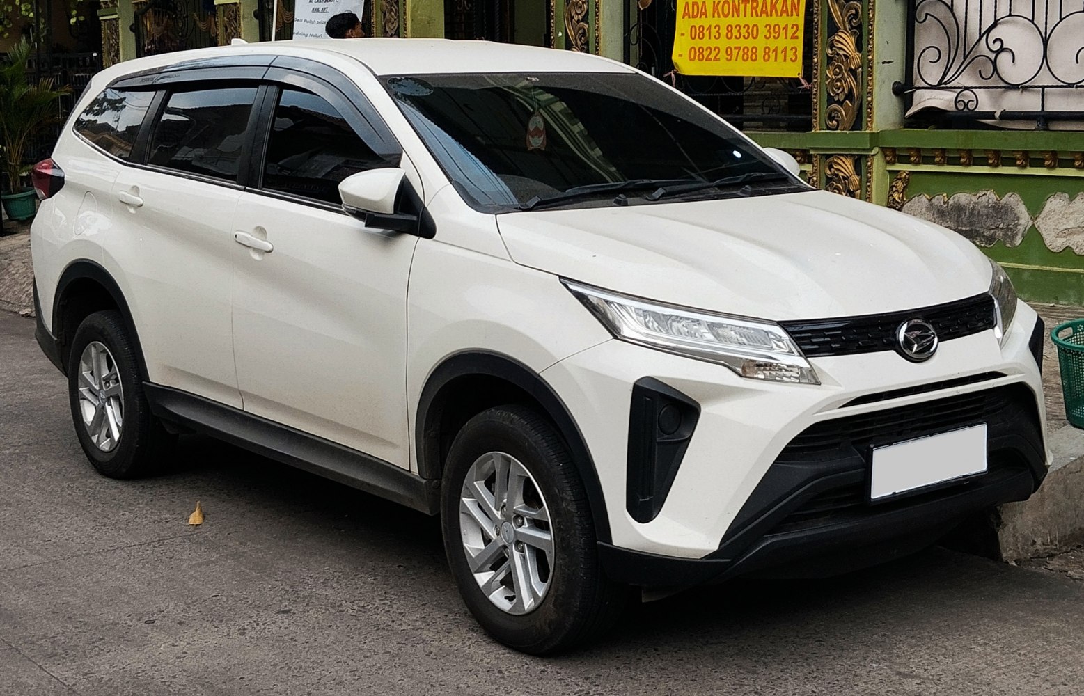 White SUV front-side angled view with sharp LED headlights
