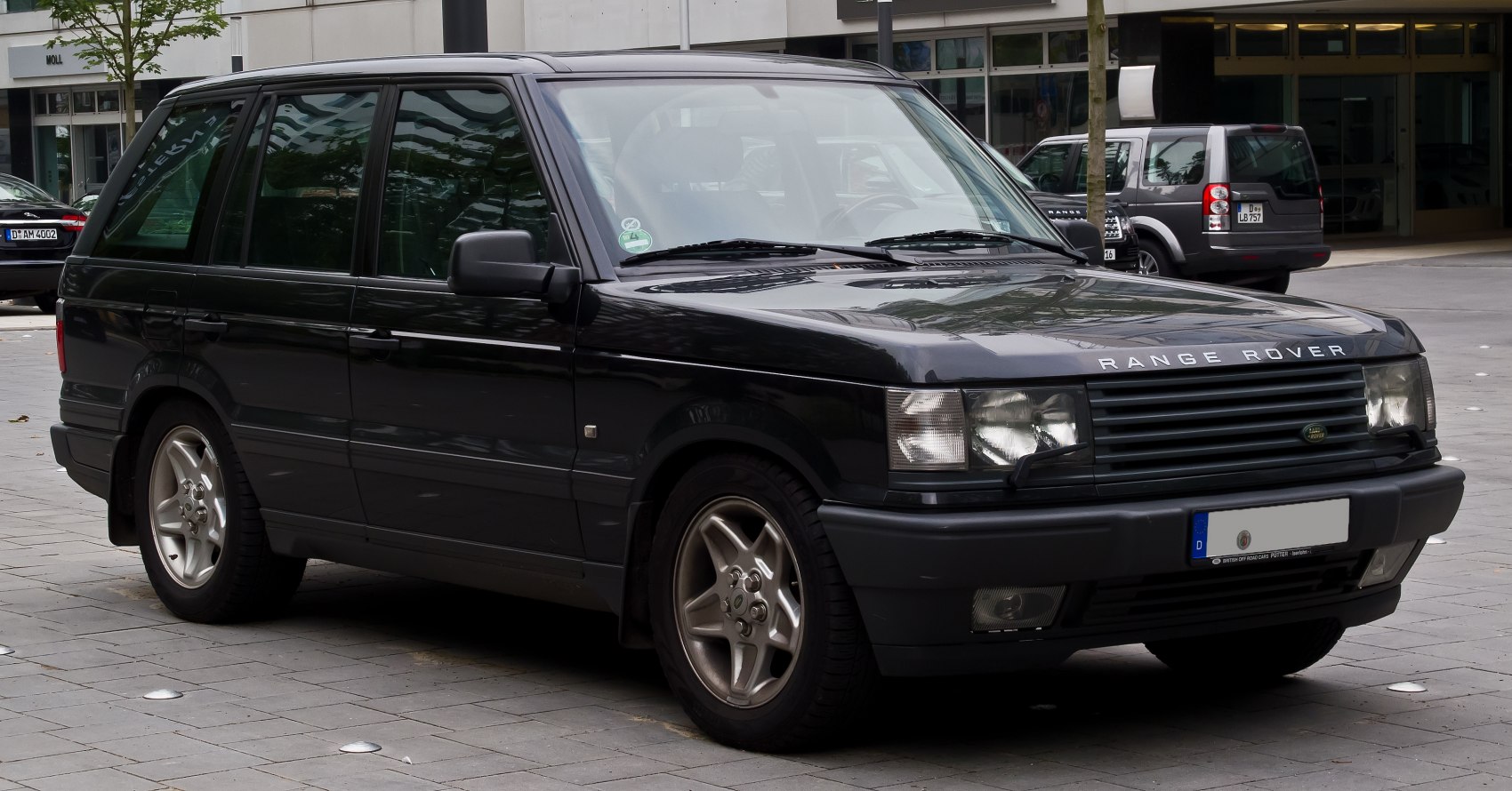 Black Range Rover II SUV front side view with iconic boxy design and alloy wheels