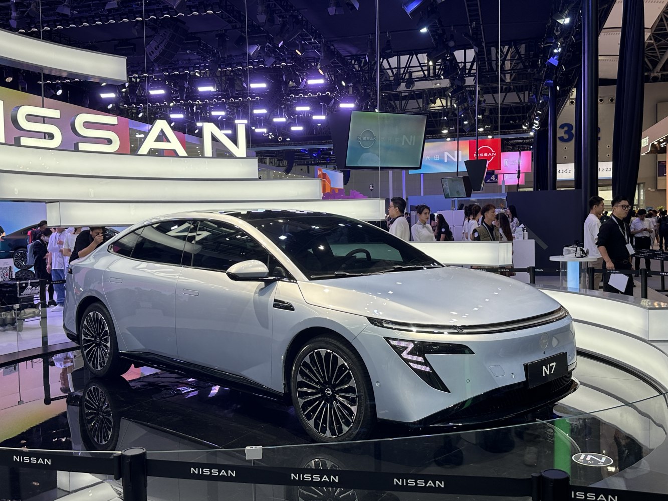 Sleek electric sedan with aerodynamic body and distinctive Z-shaped LED front headlights.