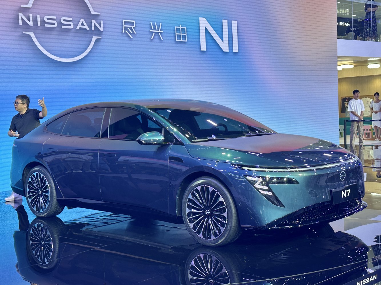 Sleek electric sedan with aerodynamic lines and distinctive LED headlights