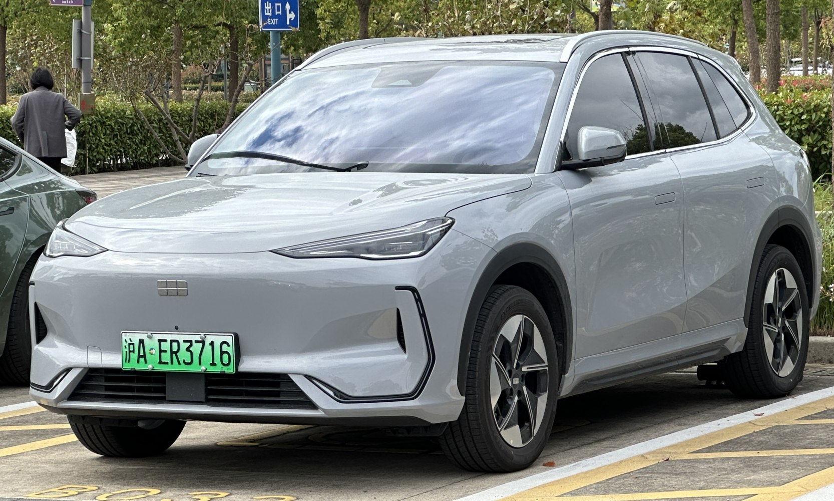 Front angle view of a sleek electric SUV with aerodynamic design and LED lights