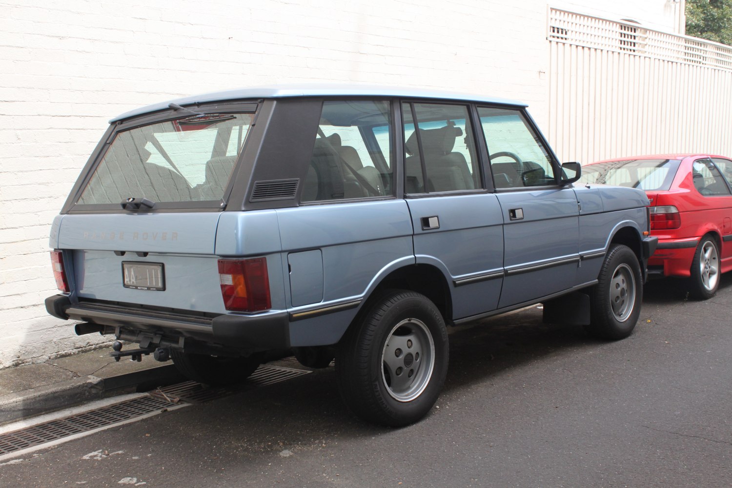 Rear side view of vintage boxy SUV design