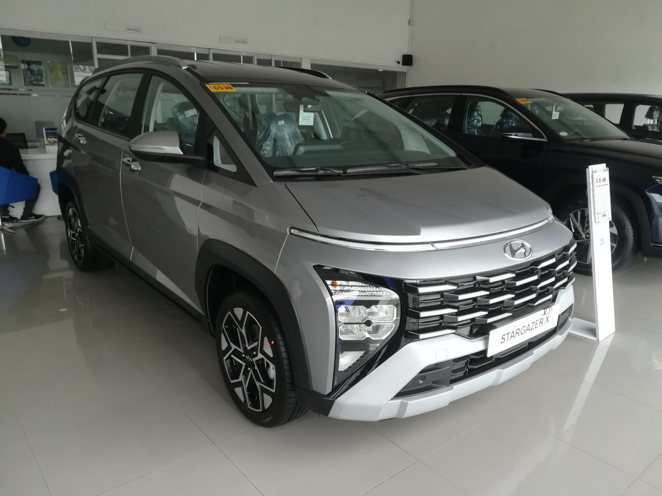 Front grille and modern split headlight design of a compact SUV
