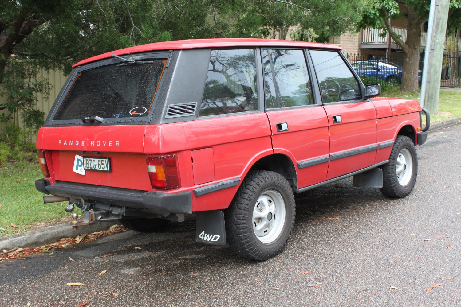 Rear side view of an SUV with 4WD and off-road tires