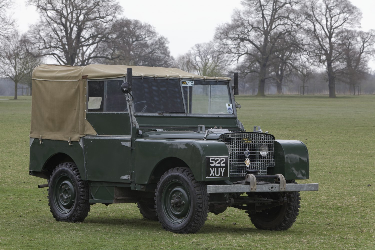 Vintage off-road vehicle with canvas roof and distinctive front grille