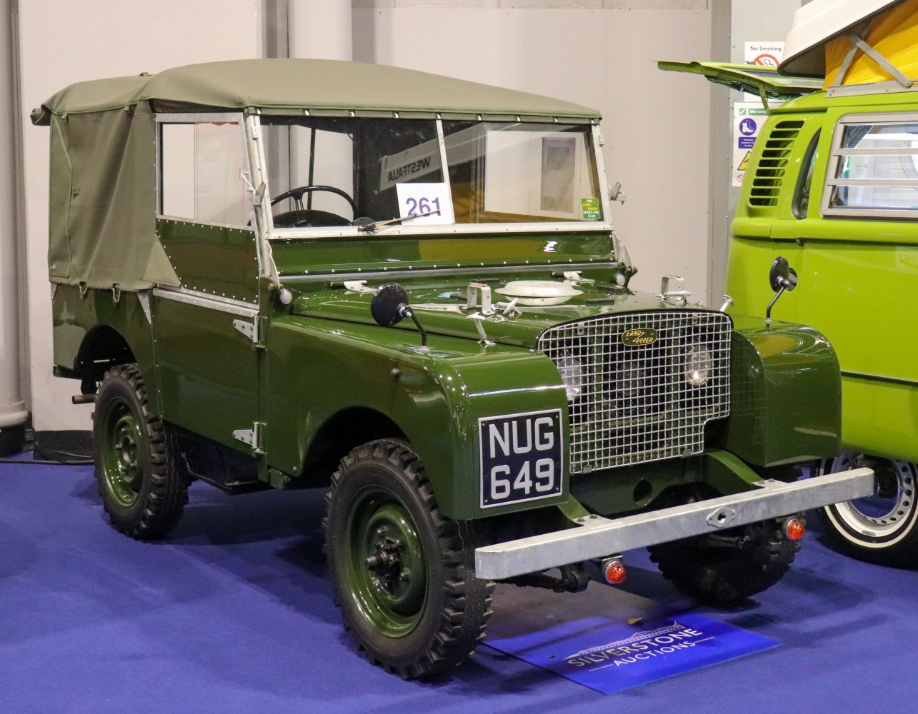 1950s rugged off-road vehicle with canvas roof and distinctive grille