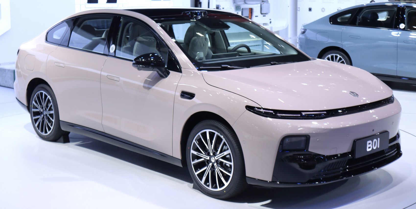 Electric sedan with sleek aerodynamic body and thin LED headlights