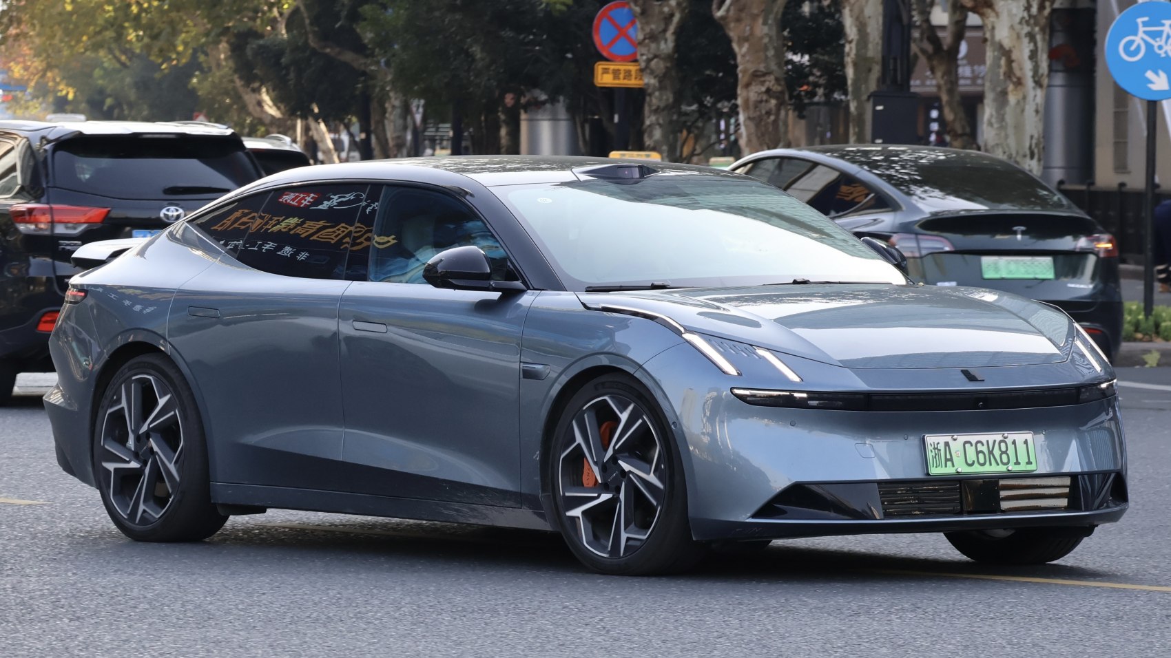 Modern electric sedan with sharp LED headlights and sporty alloy wheels