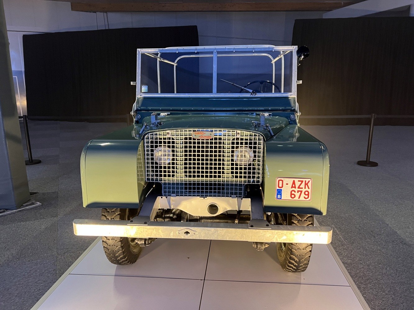 Front view with protective metal grille and rugged tires.