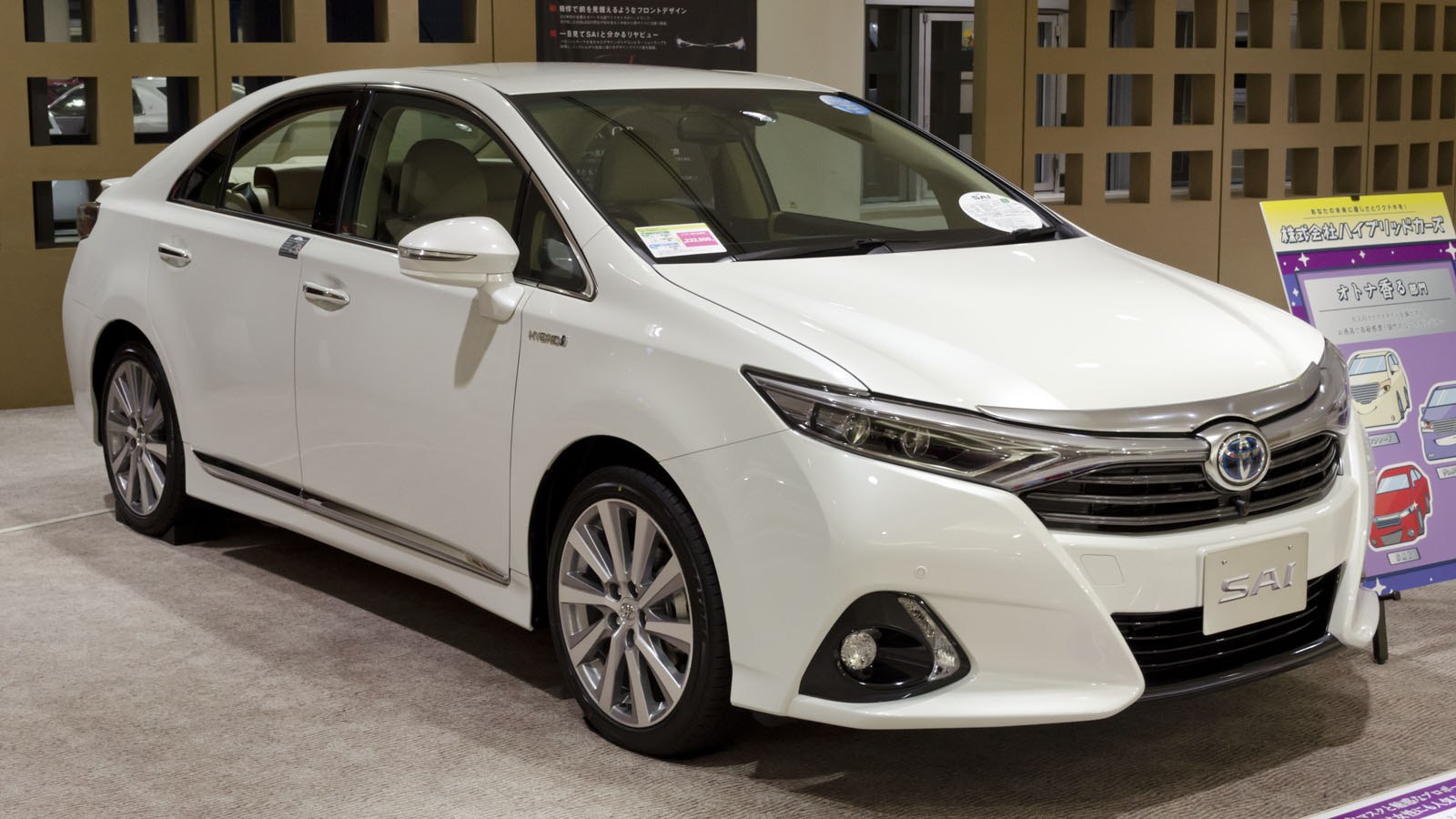 White sedan with sleek front grille and integrated fog lights