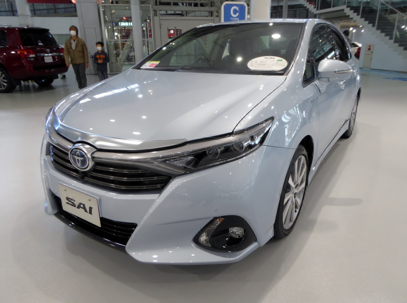 Front view with sleek LED headlights and modern grille