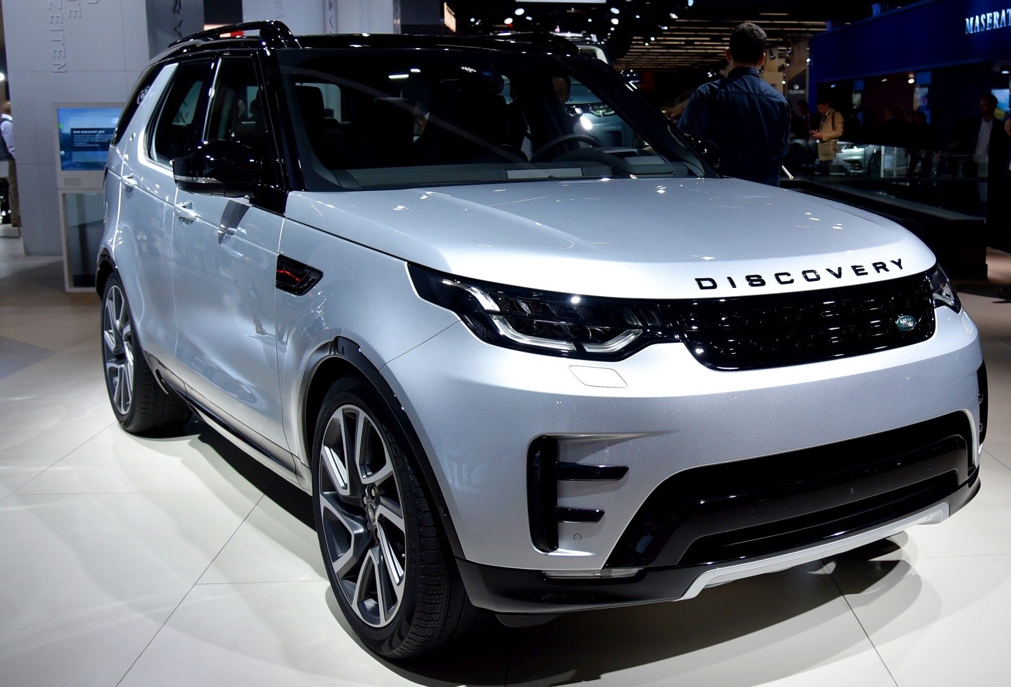 Front and side view of modern SUV with sleek headlights and bold grille