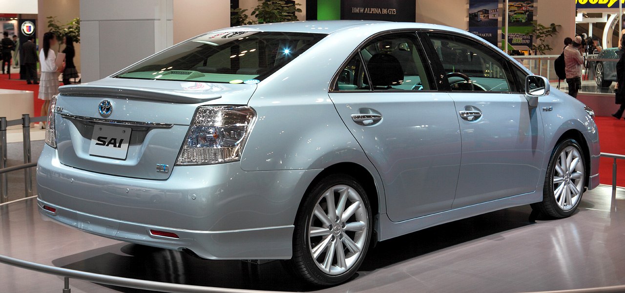 Rear view of mid-size sedan with alloy wheels and aerodynamic design