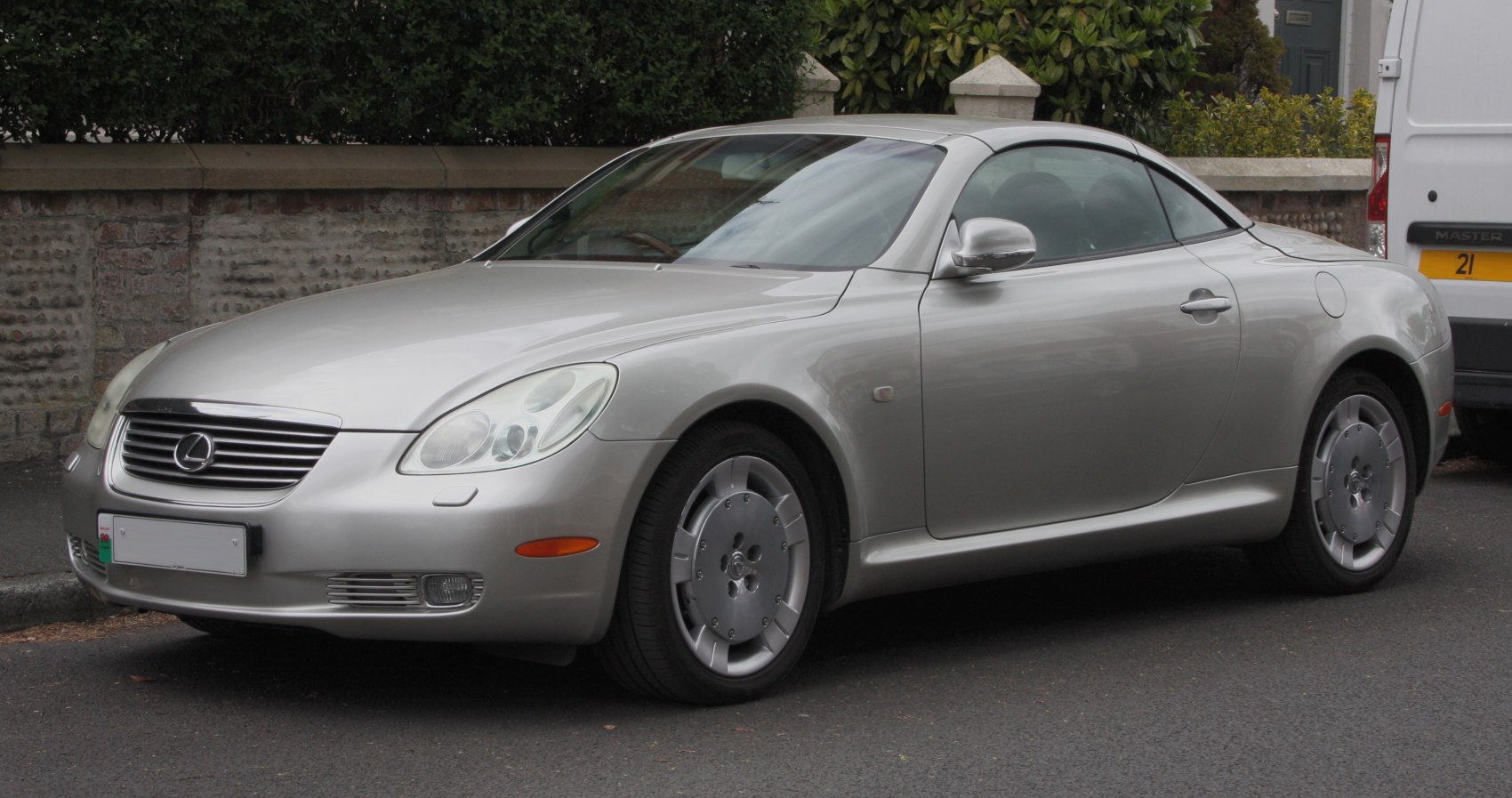 Silver coupe with sleek aerodynamic design and distinct alloy wheels