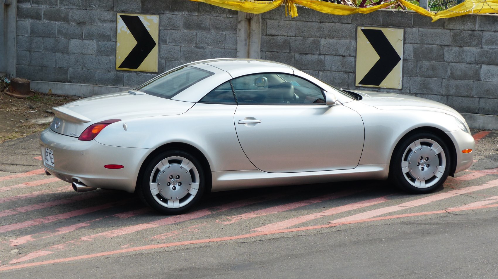 Silver luxury coupe side profile with unique wheels