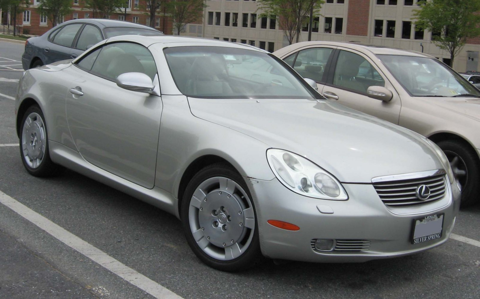 Silver sports coupe with distinctive headlights and alloy wheels