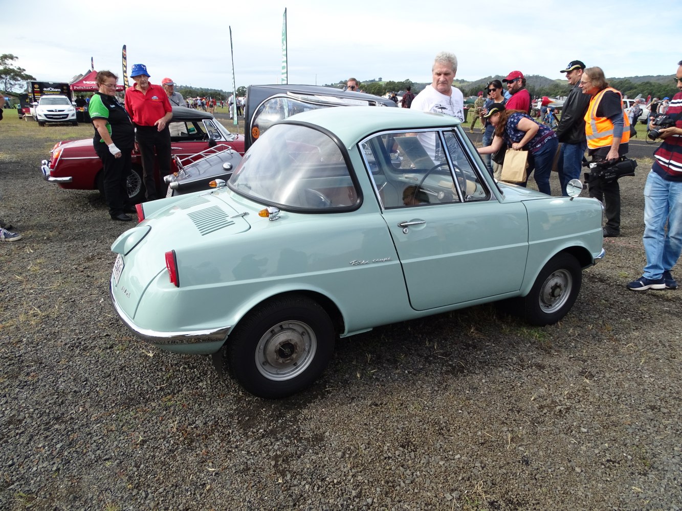 Vintage compact classic car rear and side view at outdoor show
