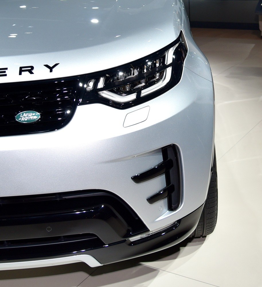 Close-up of front headlight and grille with black accents