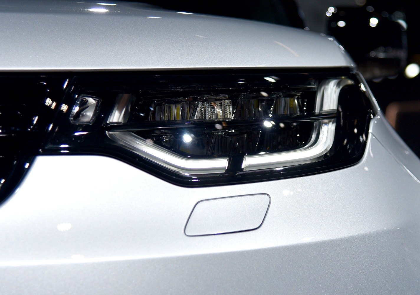 Close-up of modern LED front headlight with distinctive light signature