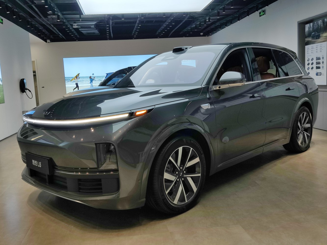 Aerodynamic headlights and modern alloy wheels on an electric SUV