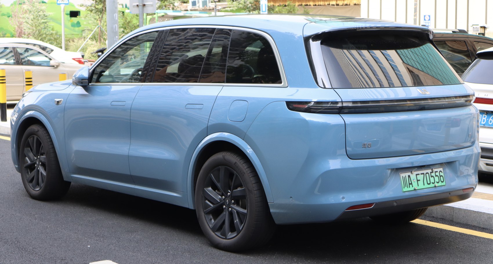 Sleek SUV rear design with black alloy wheels and tinted windows.